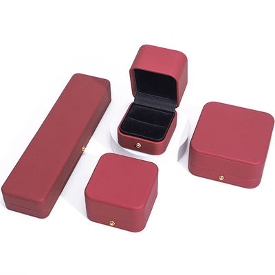 Buy Wind Red Sleek PU Leather Jewelry Storage Packaging Box with Gold Button Ornament online manufacture